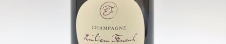 La photo montre une bouteille de champagne Emilien Feneuil en Champagne